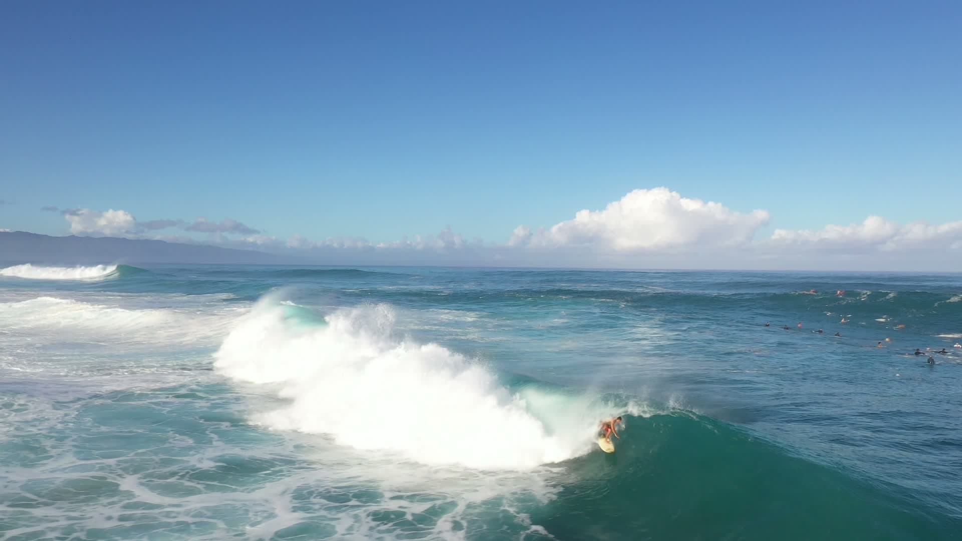 Surfer riding a breaking ocean wave