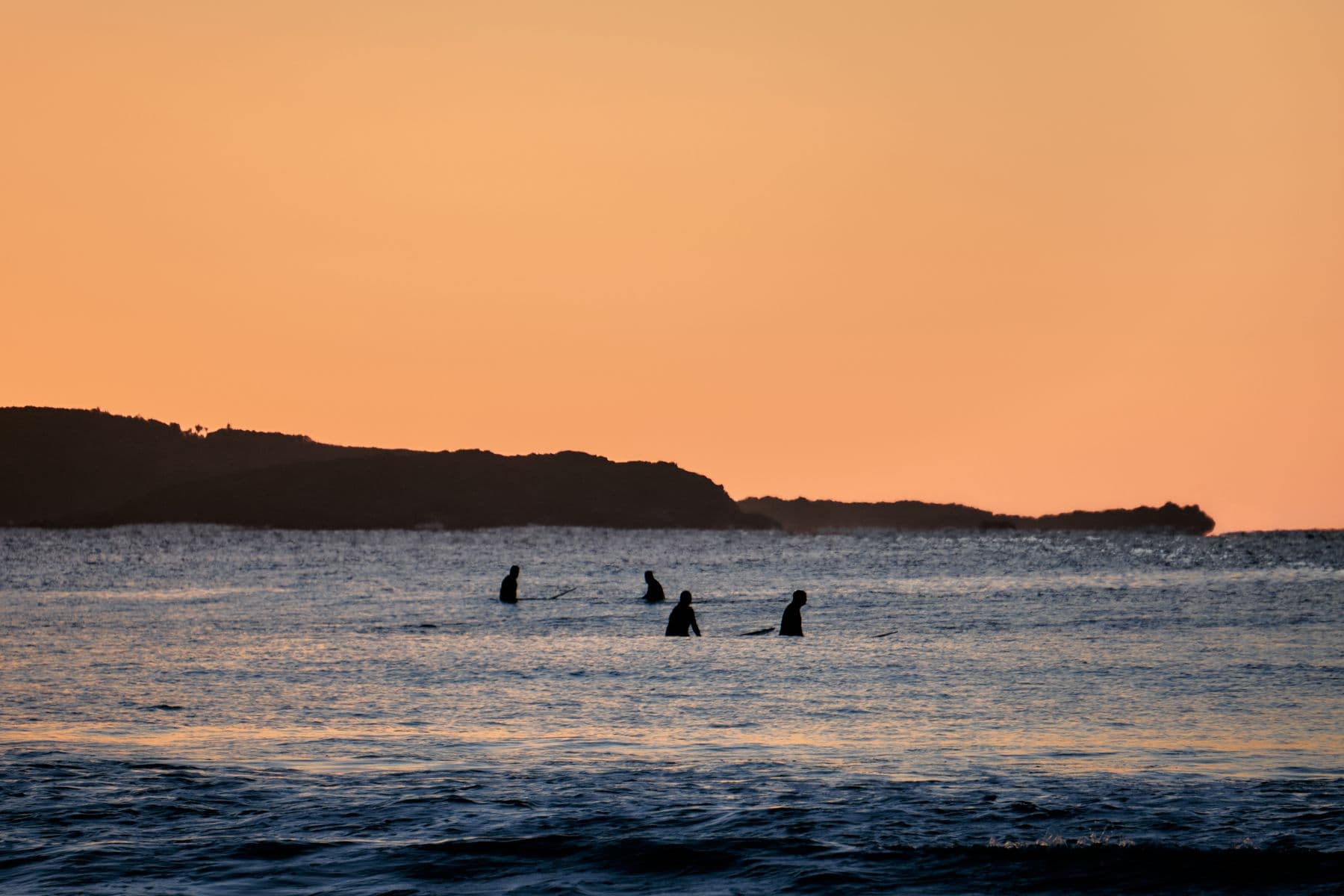 Surfers waiting together in the water